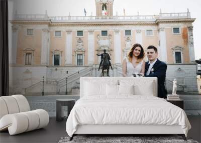 Bride and groom wedding poses in front of Capitol Hill (Campidoglio), Rome, Italy Wall mural