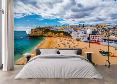 View of Carvoeiro fishing village with beautiful beach, Algarve, Portugal. View of beach in Carvoeiro town with colorful houses on coast of Portugal. The village Carvoeiro in the Algarve Portugal. Wall mural