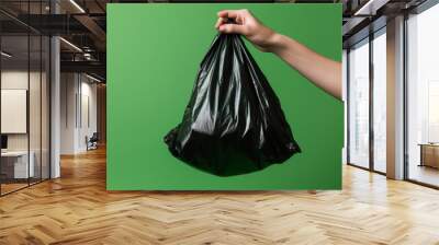 Hand picking up garbage bag. Generative AI. Wall mural