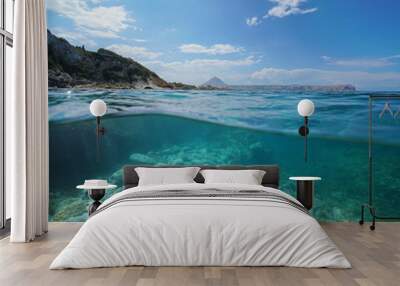 Coastline near Javea town with the cape San Antonio in background and rocks underwater, split view above and below water surface, Mediterranean sea, Costa Blanca, Alicante, Valencia, Spain Wall mural