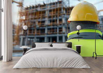 Construction Worker in Cold Weather at Building Site Wall mural