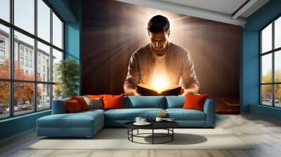 A man reading a book while holding a candle illumination background art Wall mural