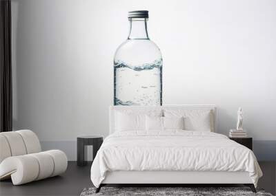 A transparent water bottle filled with liquid displaying an intricate wave pattern suggesting movement and purity Wall mural