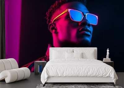 Stylish Portrait of a Young Man in Neon Glasses Wall mural