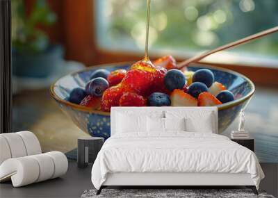 bowl of fresh fruit with a drizzle of honey Wall mural