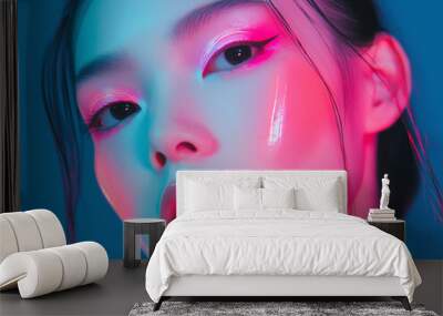 Japanese woman in futuristic neon blue attire Wall mural