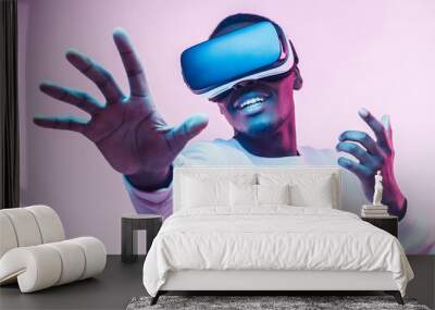 African american man in vr glasses, playing video games with virtual reality headset, trying to touch something with hand Wall mural