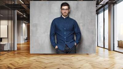 European Caucasian man in glasses standing against gray wall, isolated Wall mural