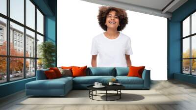 Front view of laughing african teen girl standing with hands in pockets, wearing white tshirt with copy space Wall mural