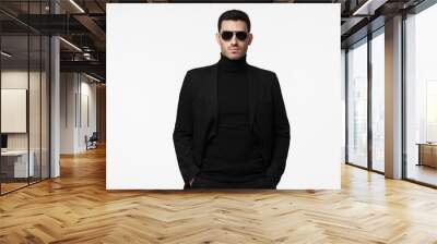 Half-length portrait of young handsome European guy isolated on white background dressed in total black with turtleneck, sunglasses and jacket, looking serious and suspicious, reserved and reticent Wall mural