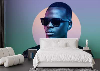 Neon studio portrait of handsome african american man wearing sunglasses and leather jacket Wall mural