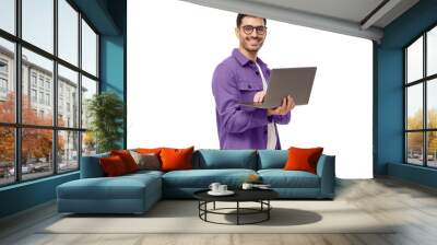 Portrait of young modern businessman standing holding laptop and looking at camera with happy smile Wall mural