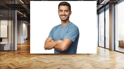 Smiling handsome young man in blue t-shirt standing with crossed arms Wall mural