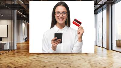 Woman holding phone and credit card, ready to purchase goods with new app Wall mural