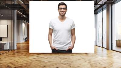 Yong man in casual t-shirt standing with hands in pockets, isolated on white background Wall mural