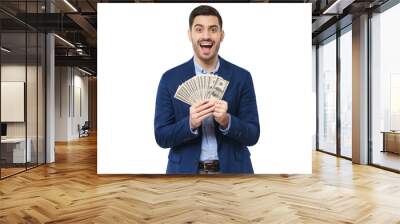 Young man holding fan of dollars in both hands, screaming with joy, winning money in lottery, feeling excited Wall mural