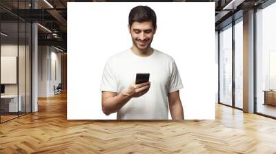 Young man wearing white t-shirt, surfing the web with phone Wall mural