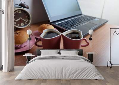 Black coffee in  two cups heart shape, bread, and laptop computer on wooden floor Wall mural