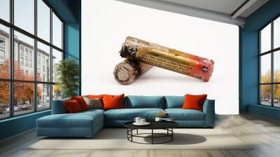 Damaged and corroded batteries isolated on white background. Wall mural