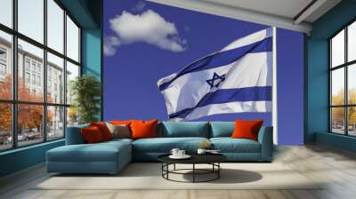 Israel flag in the wind isolated against the sky Wall mural