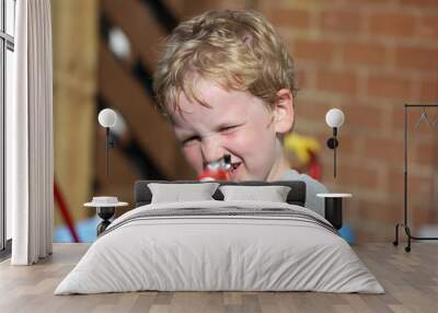 Little boy with toy gun Wall mural