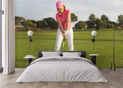 beautiful senior female golf player Wall mural