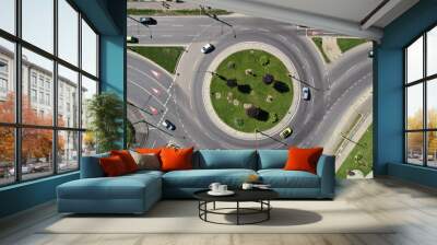 Top down aerial view of a busy street traffic circle roundabout on a main road in an urban area Wall mural