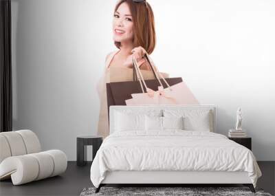 Asian girl enjoy shopping  with shopping bag isolate on white background Wall mural