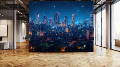 A panoramic view of a city skyline at night with a starry sky above. The cityscape is illuminated by streetlights and building lights, creating a vibrant and energetic atmosphere. Wall mural