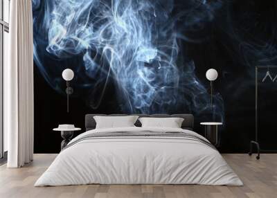 marvellous flowing contrast blue smoke against heavy black background. Wall mural