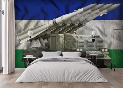 tactical short range ballistic missile with arctic camouflage on the Lesotho national flag background. 3d Illustration Wall mural