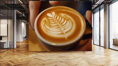 close up photo of latte coffee in a small cup with a beautiful flower picture Wall mural