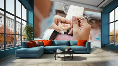 Dental technician making a denture in your dental lab Wall mural