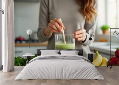 Woman cooking a smoothie, healthy lifestyle Wall mural