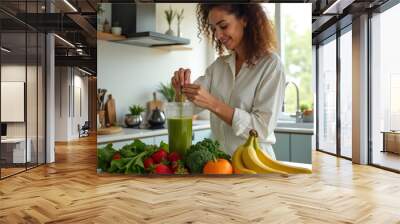 Woman cooking a smoothie, healthy lifestyle Wall mural