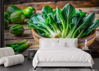 Fresh Choy Sum in a Rustic Wooden Bowl Ready for Cooking or Healthy Eating on a Table Wall mural