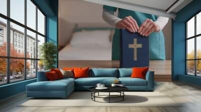 A Nurse Has The Bible. Doctor With The Bible in The Hospital.  Wall mural