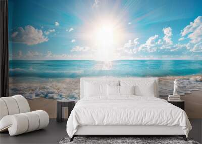 A picturesque portrayal of sun glare casting over a pristine ocean meeting a white sand beach, framed by a clear blue sky Wall mural