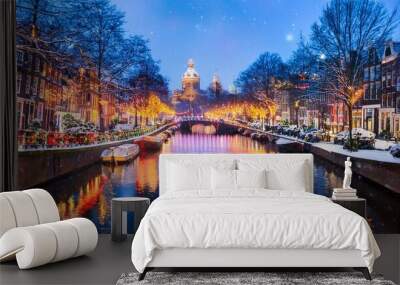 A serene view of a snowy canal in Amsterdam at night.  Wall mural