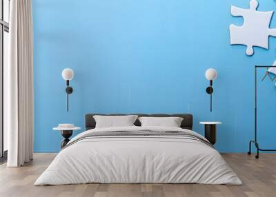 A white jigsaw puzzle on a blue background with blank space for an image. Creative banner. Copyspace image Wall mural