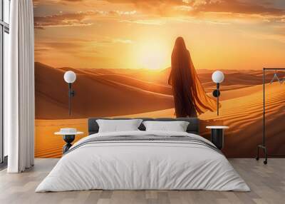 Arabian woman walk in the desert sand and dunes at sunset  Wall mural