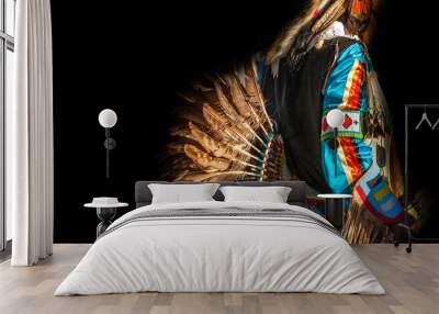 Native American Indian. Close up of colorful dressed native man isolated on black background. Wall mural