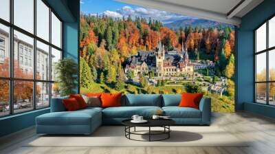 Peles Castle, Sinaia, Prahova County, Romania: Drone view of famous Neo-Renaissance castle in autumn colours, at the base of the Carpathian Mountains, Europe Wall mural