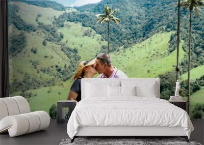 Traveling couple enjoying their vacation in a Colombian village. Valle del cocora, latinos traveling. Experiences and vacations. Wall mural