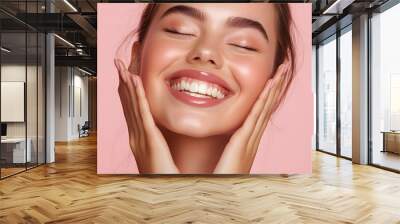 Close up of happy young woman with fresh glowing skin tone, showing beautiful white smile and grinning carefree, happy about valentines day, standing on pink background Wall mural