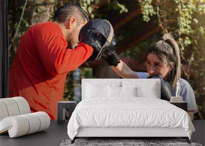 Couple in a park practicing boxing. Wall mural