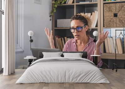 Disappointed female employee confused with bad internet connection or laptop breakdown at office. Frustrated businesswoman puzzled facing device operating problem at home work desk Wall mural