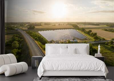 drone shot of a solar park on a street in the countryside Wall mural