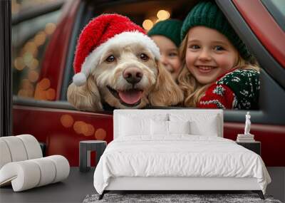 During Christmas, close up of a dog and happy children in a red car Wall mural