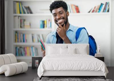 Smart young african american male student with beard Wall mural